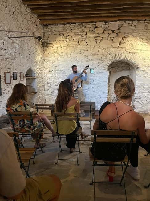 Classical guitar concert in a historic olive press - The moon, mountains, and dark sky