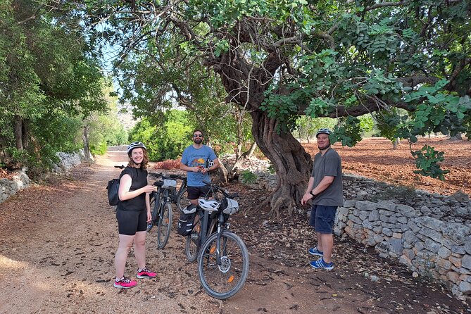 E-bike tour in Ostuni, the olive trees and the rock village - Entering Ostuni’s white old town by bike