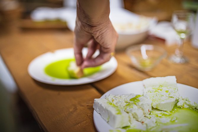Bread dipped into new olive oil at a working mill